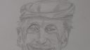 Dessin de visage souriant avec chapeau et moustache, style simple et expressif