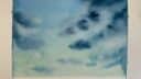 Aquarelle représentant un ciel nuageux avec des nuances de bleu